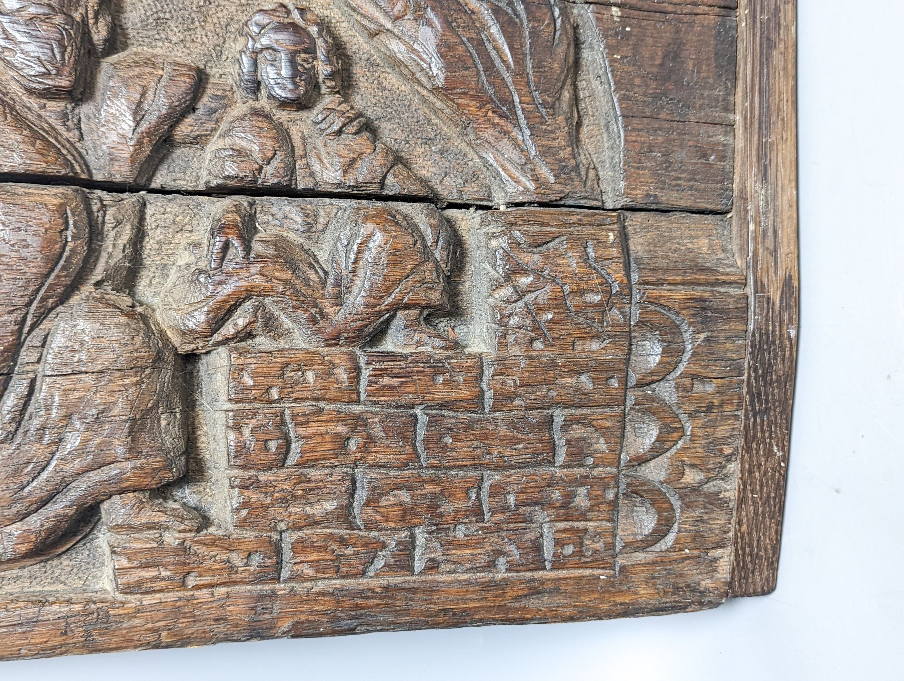 A 17th century style sunken-carved oak panel 37x61cm